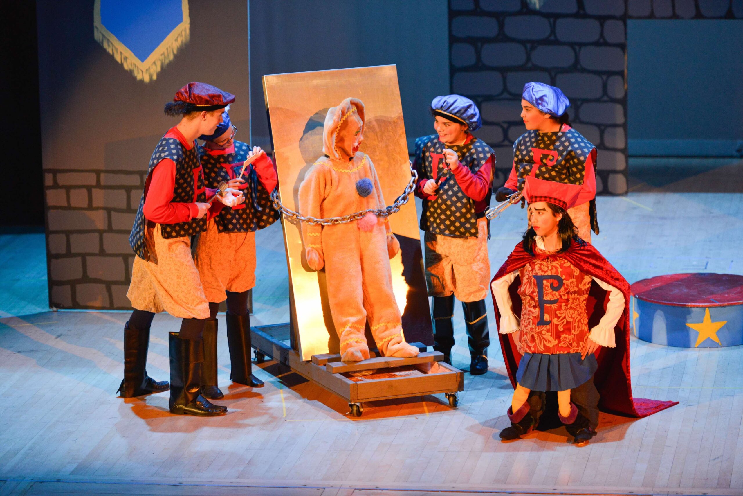 Children in costumes performing a musical at Sol Treasures.
