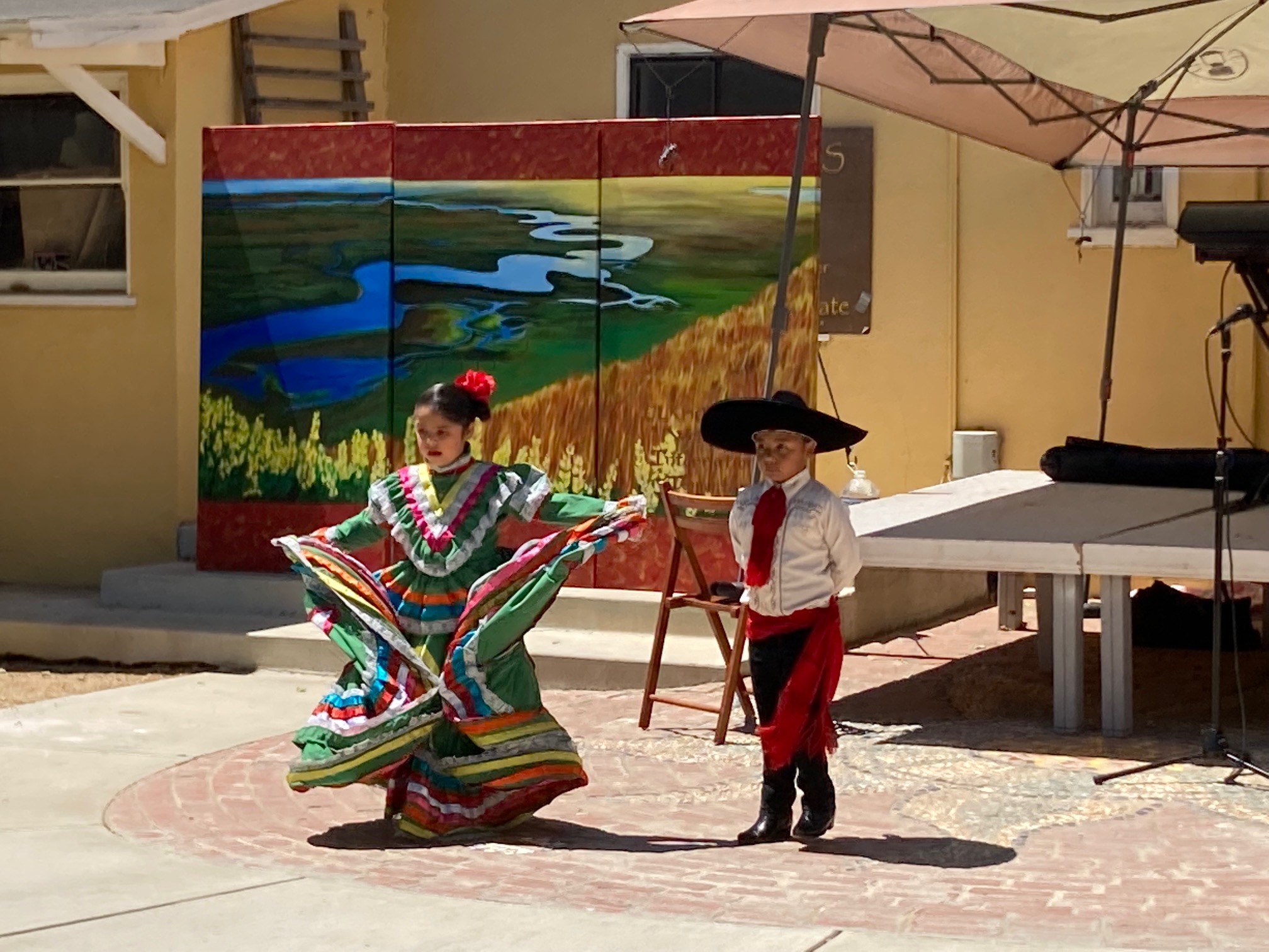 Two children performing folkloric dancing at Sol Treasures.